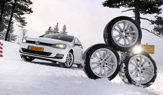 Winter tyre test 2025 - header image, tyres next to a Volkswagen Golf